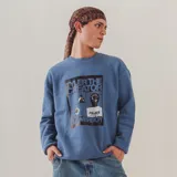 Buzo celeste con estampado frontal de Tyler, The Creator, con corte oversize.