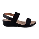 Sandalias bajas color blanco con dos tiras elásticas anchas y ajuste con velcro en el tobillo.