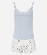 Conjunto de pijama compuesto por musculosa de rib color celeste con breteles finos y encaje en el escote, y short blanco con estampado de amuletos.