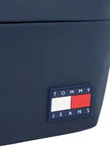 Riñonera azul marino de poliuretano con logo Tommy Jeans engomado y correa ajustable con hebilla.