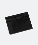 Billetera tarjetera pequeña de piel sintética negra con estampado animal print de leopardo.