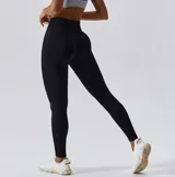 Calza deportiva larga color verde oscuro, de tiro alto y corte ajustado.