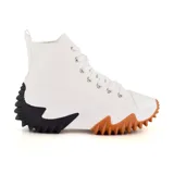Zapatillas deportivas de caña alta color blanco con suela gruesa en dos tonos: blanco y marrón en la parte delantera, y blanco y negro en la parte trasera.