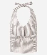 Blusa de jeans con cuello halter y escote en V, diseño a rayas verticales en color beige y blanco. Presenta cierre frontal con botones forrados y lazo para atar al cuello.