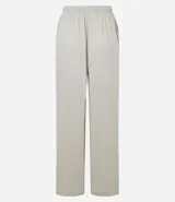 Pantalón femenino de corte fluido, color beige claro, con cintura elástica ajustable mediante un lazo.