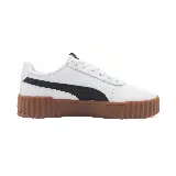 Zapatillas Puma Carina 3.0 de cuero blanco con franja lateral negra y suela marrón con textura.