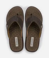 Ojotas marrones de hombre, con tiras anchas texturizadas y plantilla con diseño de círculos.