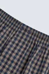 Calzoncillo tipo bóxer confeccionado en popelín de algodón con estampado a cuadros y cintura elástica.