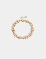 Pulsera dorada con eslabones gruesos y cierre de mosquetón con cadena de extensión.