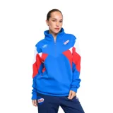 Buzo deportivo Umbro del Club Nacional de Football, para mujer. Diseño con cierre de media cremallera, mangas largas con bloques de color azul, blanco y rojo, y escudo del club bordado en el pecho.