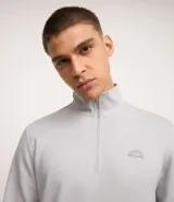 Buzo deportivo verde agua para hombre, confeccionado en algodón y poliéster. Cuenta con cuello alto con cremallera, manga larga con ajustes, bolsillo canguro y doble tejido interno.