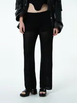 Pantalón negro de tejido de hilo calado con cintura elástica.