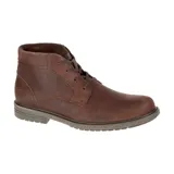 Bota de media caña en cuero tipo nubuck, con forro interno de tela respirable y suela de goma duradera.