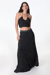 Top halter color beige de tejido de punto con lurex.