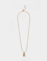 Set de dos collares cortos con dije de oso cubierto de strass, uno plateado y otro dorado.