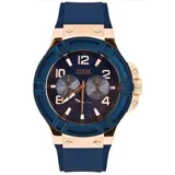Reloj Guess W0247G3 con caja redonda de acero inoxidable con acabado en tono oro rosa, esfera azul con detalles plateados y correa de silicona azul.