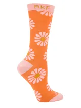 Calcetines altos color naranja con estampado de margaritas blancas y centro amarillo. Puño, talón y puntera en color rosa. Confeccionados en fibra de bambú.