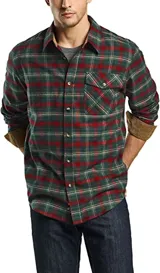 Camisa de cuadros con cuello y puños de pana, compuesta por algodón y poliéster, con cierre de botón y un solo bolsillo.