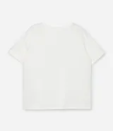 Remera de algodón color blanco con cuello redondo y mangas cortas. Presenta un estampado de lentejuelas con efecto de lluvia en el frente.