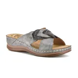 Sandalia casual color dorado con plataforma baja y detalle de flor con apliques brillantes.