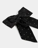 Hebilla francesa para el pelo color negro con moño de satén con lunares blancos y apliques de strass.