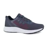 Championes deportivos American Sport Fluke, color celeste con detalles en azul marino y verde lima. Capellada de malla transpirable, ajuste con cordones y suela blanca con detalles en negro.
