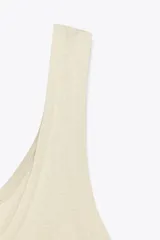 Camiseta de algodón color beige, de corte ajustado, escote redondo y sin mangas.