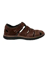 Sandalia de cuero marrón con aberturas y ajuste con velcro.