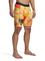 Short deportivo Under Armour con estampado abstracto en tonos naranja, amarillo y negro. Cintura elástica con logo Curry.