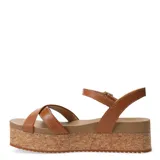 Sandalias de mujer Bottero con plataforma gruesa de corcho. Presentan tiras cruzadas negras en el empeine y una tira ajustable con hebilla en el tobillo.