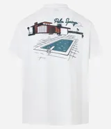 Remera blanca de algodón con cuello redondo y mangas cortas. Estampa frontal y trasera con la frase "Palm Springs" en color verde.