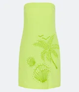 Vestido corto sin breteles color verde lima, confeccionado en lino y algodón. Presenta bolsillos laterales y bordado frontal de una palmera y conchas marinas.