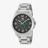Reloj Marea de acero plateado con esfera gris oscura y detalles turquesa. Incluye indicador de día de la semana y fecha. Resistente al agua hasta 50 metros.