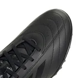 Championes de fútbol Adidas Goletto IX para pasto sintético, color negro con las tres tiras características de la marca en el lateral. Exterior de cuero sintético suave con acolchado y perforaciones. Suela de caucho con taches.