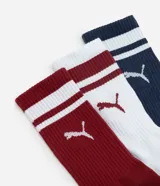 Pack de tres pares de medias de caña media Puma, con diseño a rayas horizontales en el borde superior y logo de la marca en el lateral. Incluye un par azul marino con rayas blancas, un par blanco con rayas bordó y un par bordó con rayas blancas.