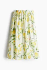 Pollera midi acampanada con cintura elástica y estampado de limones y flores.