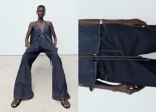 Pantalón de jean wideleg de tiro bajo con cierre de botón y cremallera, cinco bolsillos y diseño largo.