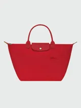 Cartera tote plegable de nylon color negro con cierre y asa corta, modelo Le Pliage Green.