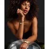 Reloj Fossil modelo Harlow con caja octogonal dorada de 27mm, esfera color crema con números romanos negros y malla metálica dorada.