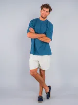 Mocasines náuticos de cuero azul marino con cordones marrones, ojales metálicos y suela de yute.