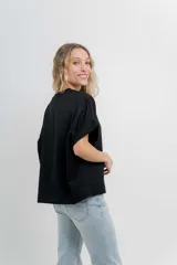 Buzo verde agua de algodón grueso, manga corta y corte oversize.