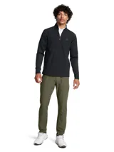 Buzo deportivo Under Armour Drive Pro, color verde agua, con cierre parcial frontal, cuello alto y logo en el pecho.