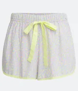 Short de pijama runner con estampado de lunares en tonos pastel y cordón amarillo contrastante en la cintura elástica.