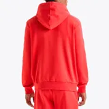Buzo hoodie rojo con cordones y logo Diadora estampado en blanco en el pecho.