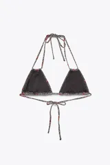 Top de bikini triangular con estampado animal print de leopardo y cerezas rojas. Tiene tirantes finos dobles y cierre ajustable con lazadas en cuello y espalda.