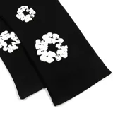 Pantalón de jogging negro con estampado de coronas de algodón blancas.