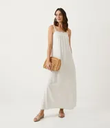 Vestido midi de tirantes finos color crudo, confeccionado en tejido de viscolino con bordado calado en el escote.