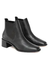 Botines Chelsea negros de cuero con elástico lateral y tacón bloque.