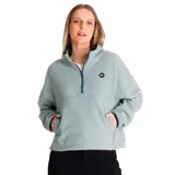 Buzo polar verde oscuro de microfleece, con cierre medio frontal con tirador con logo de Cat, bolsillo tipo canguro con costura divisoria, banda ajustable y parche de silicona con el logo de Caterpillar en el pecho izquierdo.
