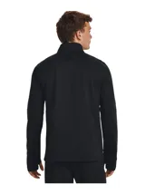 Buzo deportivo Under Armour Challenger de hombre, color naranja con paneles laterales en gris oscuro, cuello alto con cierre de cremallera corto, mangas largas con orificios para los pulgares y logo de la marca estampado en el pecho.